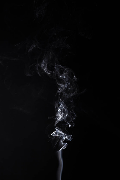 Turbilhão fumegante de aromastick
 - Foto, Imagem