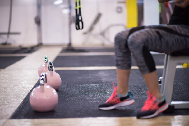 young  woman athlete exercise with fitness kettlebell at cross fitness gym - Foto, Imagen