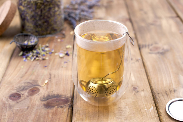 A mix of herbal tea with lavender, on a wooden background. Vintage photo. Free space for the text. Copy space - Foto, Imagem