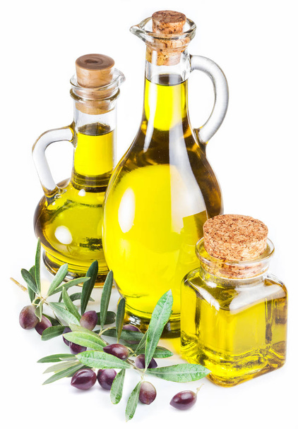 Bottles of olive oil and olive berries on white background. - Photo, Image