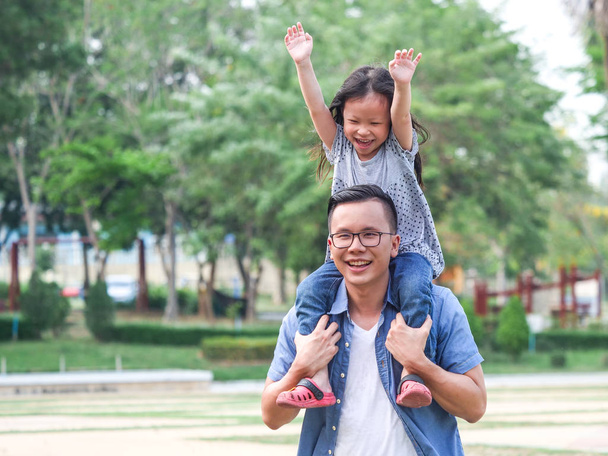 Father and daughter playing in the park,Happy father's day concept. - Photo, image