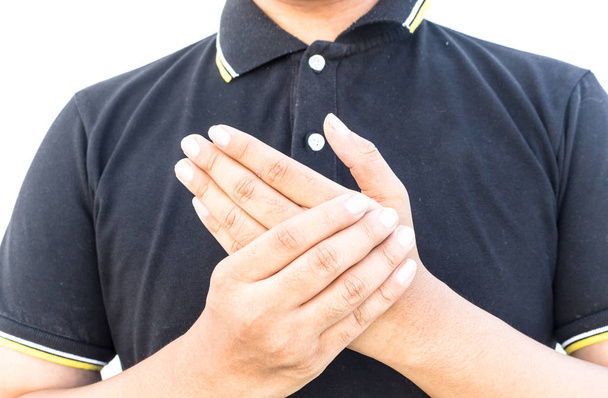 Man holds his hand acute pain in a wrist isolated on white background - Φωτογραφία, εικόνα