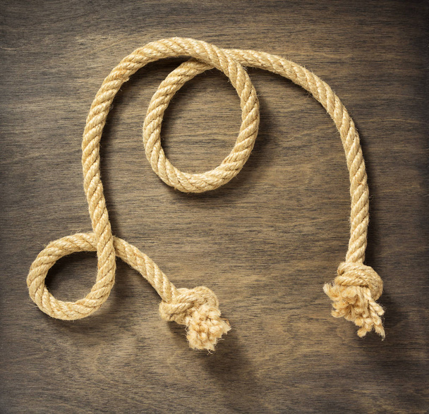 ship rope on aged wooden background - Foto, Bild