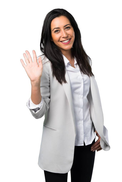 Pretty woman saluting on white background - Foto, Bild