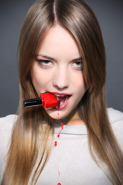 portrait of young pretty woman with with red nail polish - Foto, imagen
