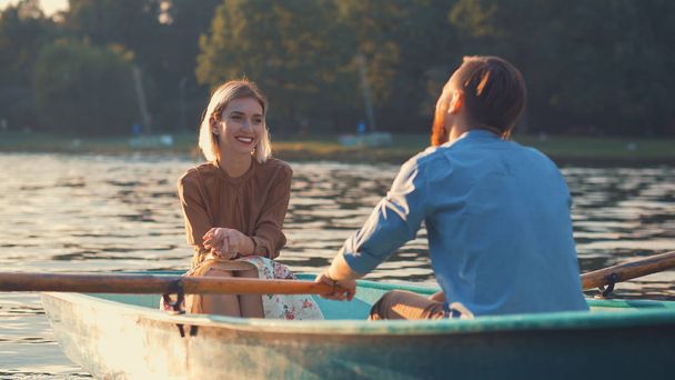 Young couple in a boat in summer - Photo, Image