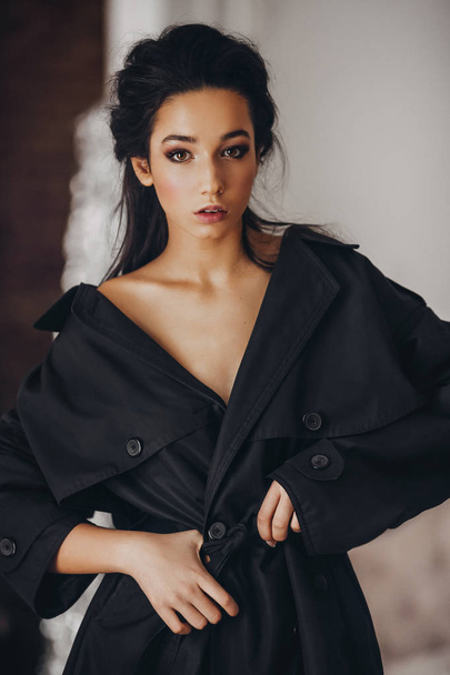 Portrait Beautiful Young Brunette Woman  with Makeup   in black trench - Foto, Imagen