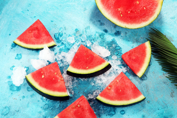 watermelon on blue background. juicy summer fruit in slices. - Photo, Image