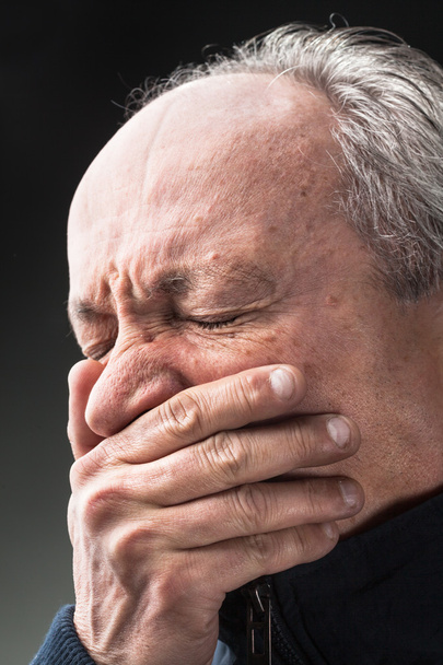 Toothache. Elderly man with face closed by hand - Photo, Image