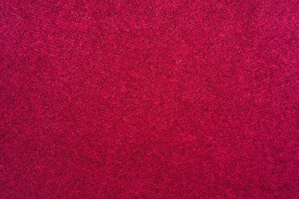 macro textuur van weefsel van een fluwelen van rode kleur voor een abstracte achtergrond of wallpaper - Foto, afbeelding