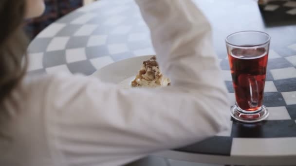 View of unrecognizable girl eats very nice dessert. 4K - Video