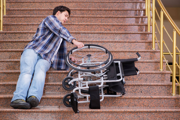 Disabled man on wheelchair having trouble with stairs - Photo, Image