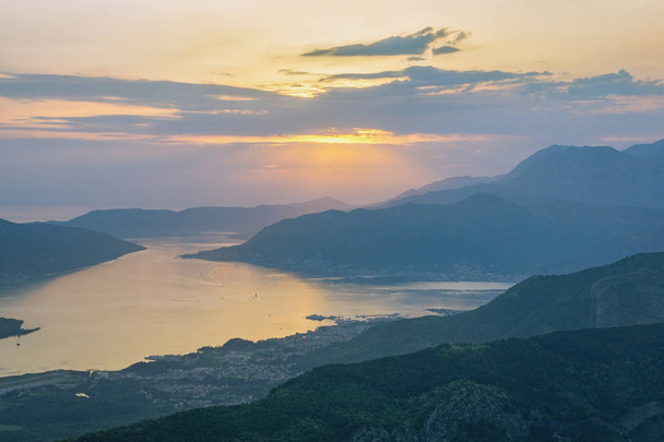 Evening Mediterranean landscape. Sunset. Montenegro, view of Gulf of Kotor (Adriatic Sea) and Tivat city from the Lovcen mountain - Photo, image