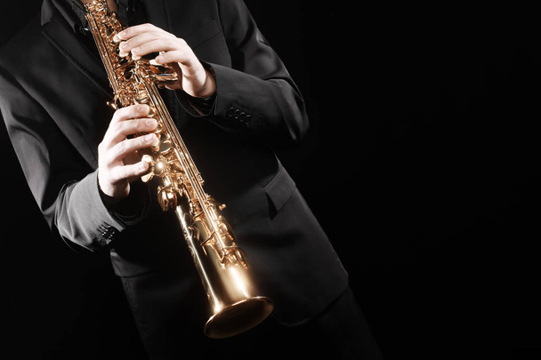 Saxophone player jazz music instrument. Sax player saxophonist with alto saxophone hands closeup - 写真・画像