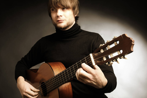 Acoustic guitar player. Classical guitarist playing guitar spanish - Fotografie, Obrázek