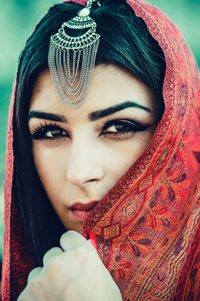 photo of beautiful woman with makeup wearing traditional Arabic dress - Photo, Image
