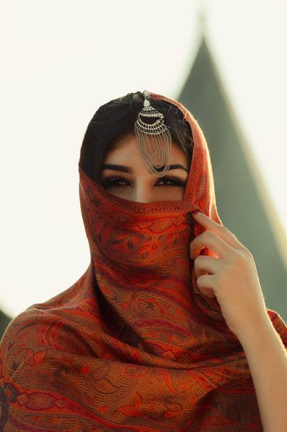 photo of beautiful woman with makeup wearing traditional Arabic dress - Fotografie, Obrázek