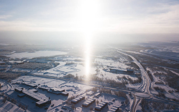 Aerial winter view of Kiruna, the northernmost town in Sweden, province of Lapland, winter sunny picture shot from drone - Photo, Image