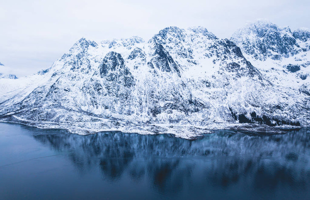 Aerial winter view of Lofoten Islands, Nordland, Norway, with fjord, road and mountains, shot from drone - Fotografie, Obrázek