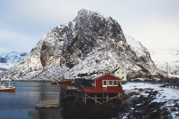 Beautiful super wide-angle winter snowy view of Reine, Norway, Lofoten Islands, with skyline, mountains, famous fishing village with red fishing cabins, Moskenesoya, Nordlan - Fotoğraf, Görsel