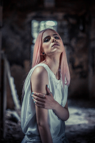 photo of young charming woman with pink hair and piercing - Foto, imagen