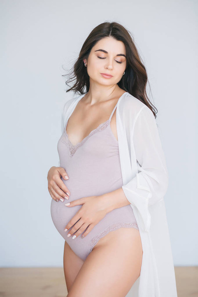 Pregnant girl in anticipation of a child, beautiful pregnant girl - Φωτογραφία, εικόνα