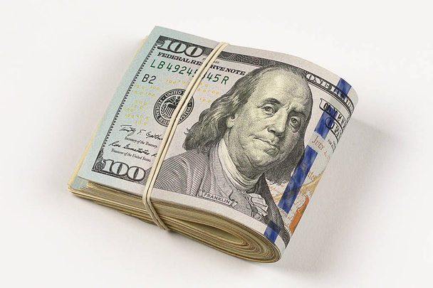 100 dollar bill roll isolated on white background - Φωτογραφία, εικόνα