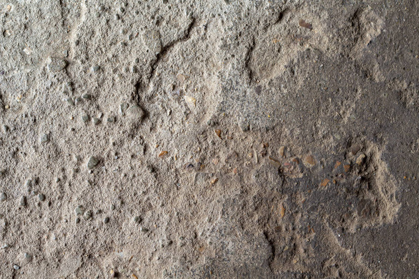 Grunge stone texture photo. Natural stone background. Weathered rock relief. Old building stone wall surface closeup. Distressed stone texture. Solid construction material. Grungy rock formation - Foto, Bild