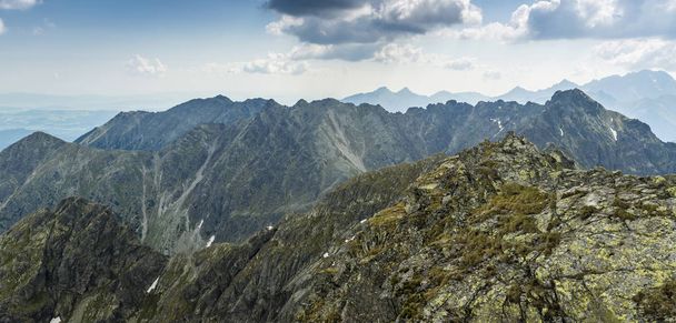 A large panoramic photo of a mountain ridge. Clouds are coming over. - Photo, Image
