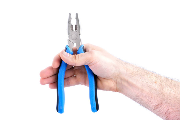 electric tool, man hand holding blue pliers isolated on white background close-up - Фото, изображение