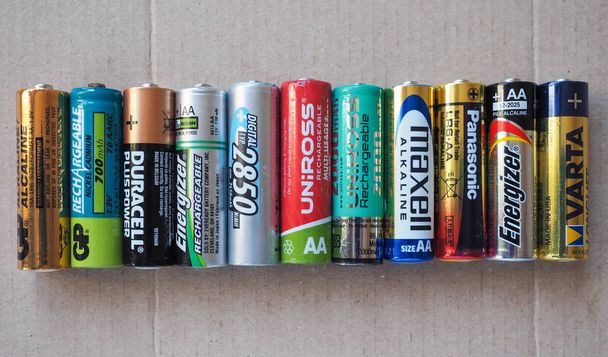 BERLIN, GERMANY - CIRCA MAY 2018: AA batteries of many different brands including GP Duracell Energizer Ansmann Uniross Maxell Panasonic Varta - Photo, Image