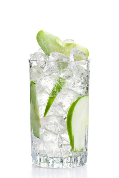 Glass of cold apple lemonade with ice isolated on white - Valokuva, kuva