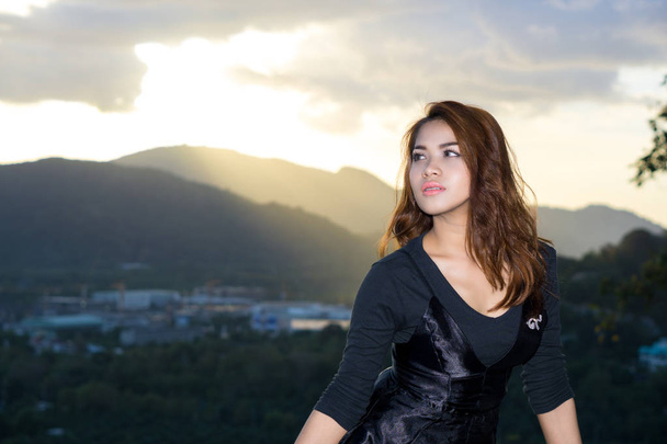 Bell portrait shooting in Rang Hill, Phuket, Thailand. She was capture with sunset background. This is a famous place sunset view point in Phuket city. - Photo, Image