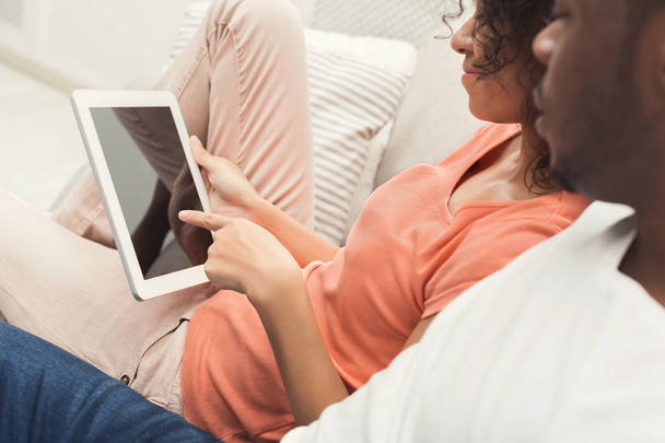 Black couple using digital tablet at home - Foto, Imagem