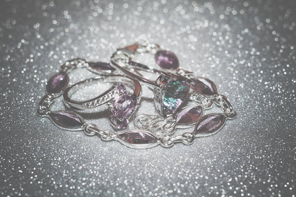 Fashion silver ring decorated with natural amethyst gemstone filtered. - Photo, Image