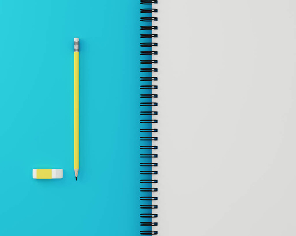 Sketchbook and yellow pastel pencil, Eraser on blue and white background. Top view , flat lay. Minimal work space. The concept of work to plan to achieve the goal. - Zdjęcie, obraz