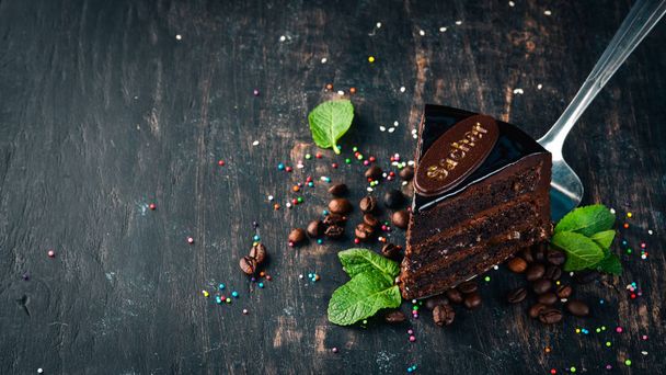 Sacher Chocolate Cake. On a wooden background. Top view. Copy space. - Foto, immagini