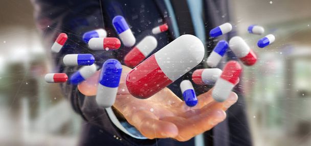  Businessman holding  a 3d rendering of medical pills  - Photo, Image