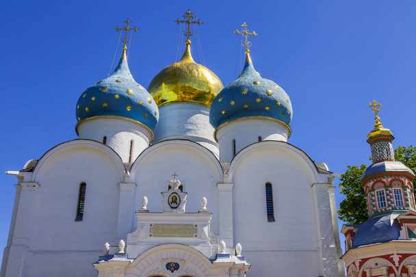 SERGIYEV POSAD, RUSSIA, on MAY 21, 2018. Troitsko-Sergiyevskaya Laurus, main sight of the city and one of significant orthodox shrines. Church in the territory of the monastery - Zdjęcie, obraz