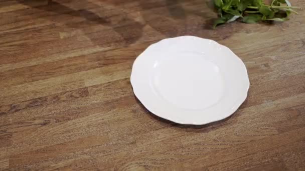 Chef putting a tortellini on a plate - Filmati, video