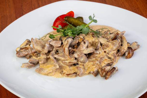 Delicious fried beef stroganoff with salad - Photo, Image