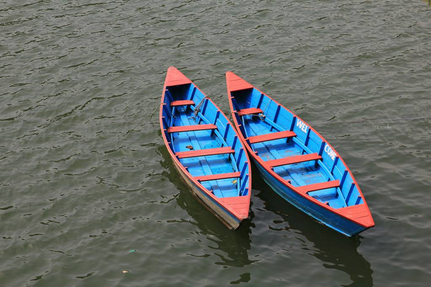 Beautiful timber rowing boats on Fewa lake, Nepal. - Photo, Image