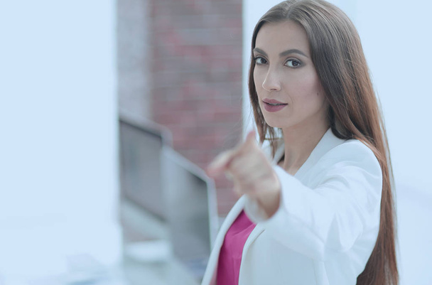confident business woman pointing finger forward - Photo, image