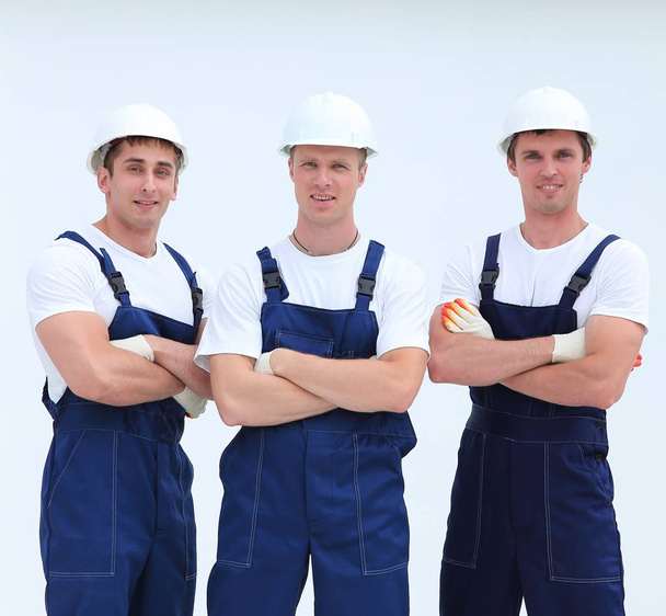 successful team builders in overalls and helmets - Foto, Imagem