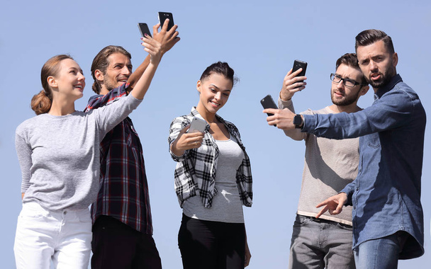 group of young people taking a selfie. - 写真・画像