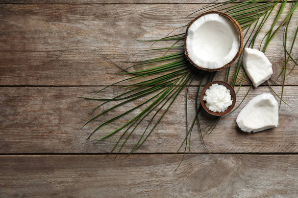 Composition with coconut oil on wooden background, top view. Healthy cooking - Valokuva, kuva
