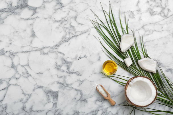 Composition with coconut oil on marble table, top view. Healthy cooking - Photo, image