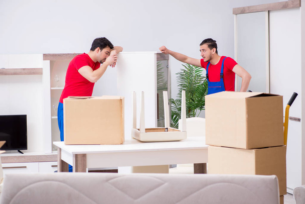 Two contractor employees moving personal belongings - Φωτογραφία, εικόνα