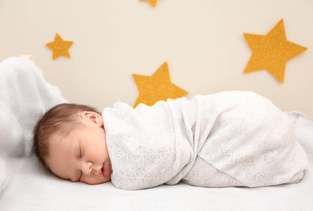 Adorable newborn baby sleeping in bed - Fotografie, Obrázek