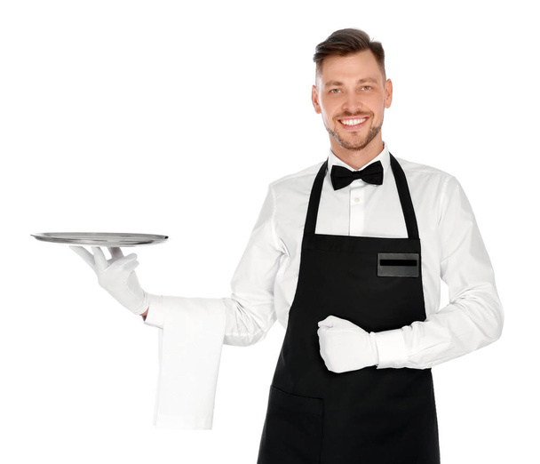 Handsome waiter with empty tray on white background - 写真・画像
